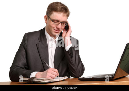 Young handsome business man making a phone call on his smartphone Stock Photo