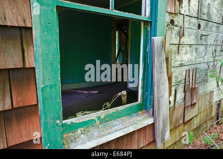 Window on abandoned house in Tahawus, abandoned mining ghost town in New York state, Stock Photo