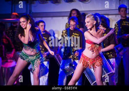 Live music Rhythms of the City samba band on stage with dancers at Brecon Jazz Festival 2014 Stock Photo