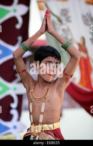 Eight year deaf boy of a School for the Hearing Impaired performs a traditional hindu pantomime dance. Lucknow, India Stock Photo