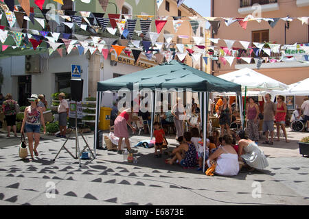 Local market and fiesta in the market plaza in Orba, Spain Stock Photo