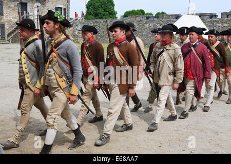 American Revolutionary war reenactors marching out to battle. Stock Photo