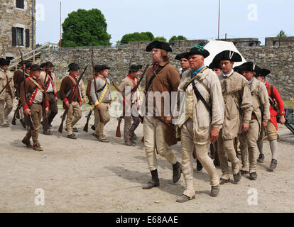 American Revolutionary war reenactors marching out to battle. Stock Photo