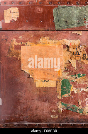 Close up of old brown leather bag that has traveled a lot. Stock Photo