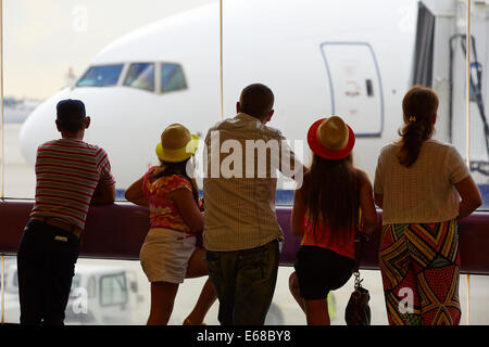 Miami International Airport MIA Miami-Dade County, Florida, in USA Pictured a family and passengers watching Transaero Airlines Stock Photo