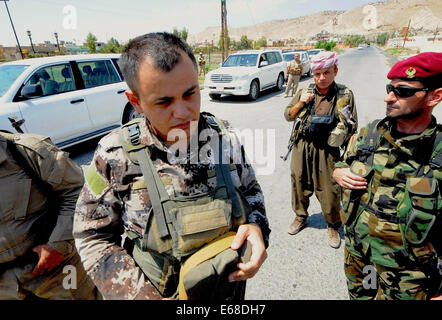 Al Quosh, Iraq. 18th Aug, 2014. Peshmergas leave Al Quosh. after patrolling the areas around Mosul dam which is currently under fire from fighting between Kurdish Peshmerga forces and the Jihadists Islamic State. Credit:  Gail Orenstein/ZUMA Wire/Alamy Live News Stock Photo