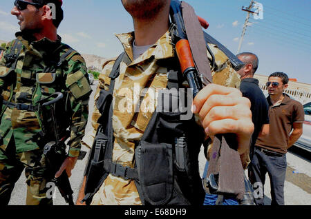 Al Quosh, Iraq. 18th Aug, 2014. Peshmergas leave Al Quosh. after patrolling the areas around Mosul dam which is currently under fire from fighting between Kurdish Peshmerga forces and the Jihadists Islamic State. Credit:  Gail Orenstein/ZUMA Wire/Alamy Live News Stock Photo