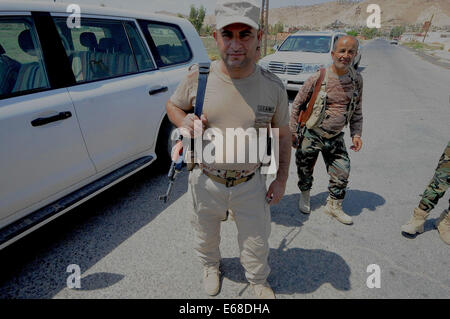 Al Quosh, Iraq. 18th Aug, 2014. Peshmergas leave Al Quosh. after patrolling the areas around Mosul dam which is currently under fire from fighting between Kurdish Peshmerga forces and the Jihadists Islamic State. Credit:  Gail Orenstein/ZUMA Wire/Alamy Live News Stock Photo