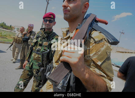 Al Quosh, Iraq. 18th Aug, 2014. Peshmergas leave Al Quosh. after patrolling the areas around Mosul dam which is currently under fire from fighting between Kurdish Peshmerga forces and the Jihadists Islamic State. Credit:  Gail Orenstein/ZUMA Wire/Alamy Live News Stock Photo