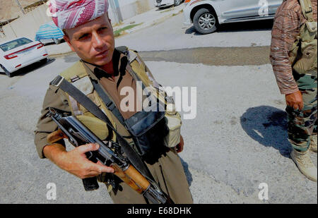 Al Quosh, Iraq. 18th Aug, 2014. Peshmergas leave Al Quosh. after patrolling the areas around Mosul dam which is currently under fire from fighting between Kurdish Peshmerga forces and the Jihadists Islamic State. Credit:  Gail Orenstein/ZUMA Wire/Alamy Live News Stock Photo