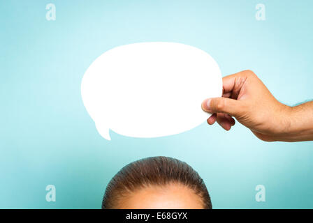 Woman thinking concept on blue background Stock Photo