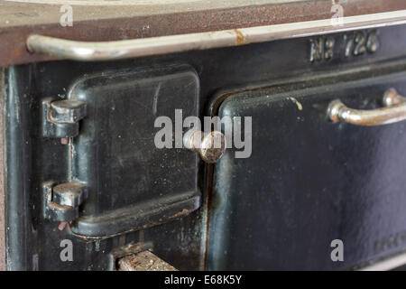 Old black iron oven from the early 20th century Stock Photo