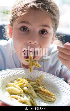 Child eating pasta Stock Photo
