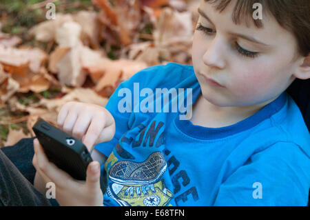 Boy and mobile phone Stock Photo