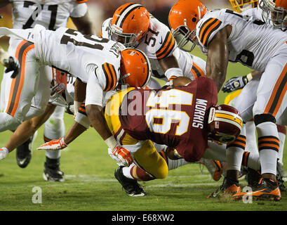 Landover, MD., US. 18th Aug, 2014. Washington Redskins running back Alfred Morris (46) is tackled by Cleveland Browns cornerback Justin Gilbert (21) during the first half of their NFL preseason game at FedEx Field in Landover, MD Monday, August 18, 2014. Credit:  Harry Walker/Alamy Live News Stock Photo