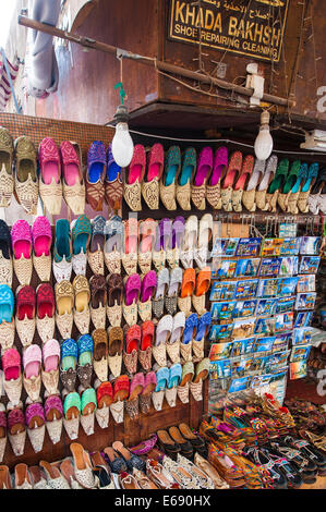Arabic slippers footwear shoes in the Textile Souk in Bur Dubai, Dubai, United Arab Emirates UAE. Stock Photo