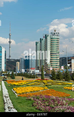 Modern apartment buildings and commercial buildings on Al-Farabi Avenue in the Medeo township, TV tower at the back, Almaty Stock Photo