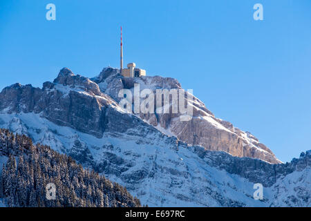 The snow-covered summit of Mt Säntis, 2502 m, with the hill station, Urnäsch, Canton of Appenzell Ausserrhoden, Switzerland Stock Photo