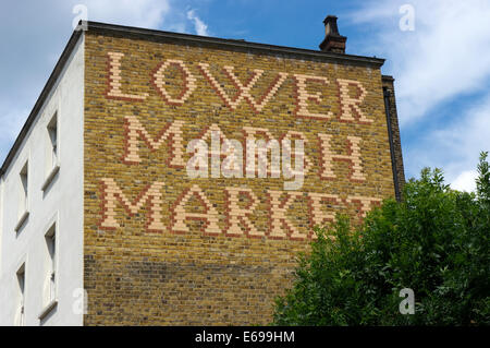 Sign for Lower Marsh Market in patterned brickwork on the side of a building near Waterloo, London. Stock Photo