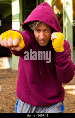 Caucasian boxer with fists raised Stock Photo