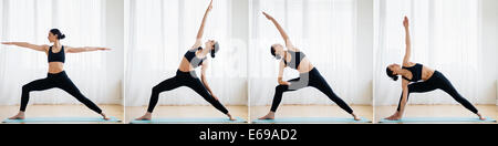 Caucasian woman practicing yoga sequence Stock Photo