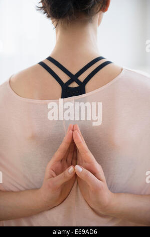 Caucasian woman practicing yoga Stock Photo