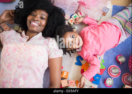 Mother and daughter playing together Stock Photo