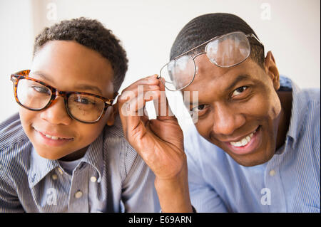 Father and son wearing glasses together Stock Photo