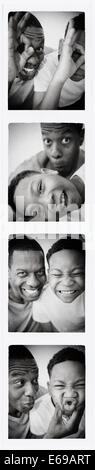 Father and son smiling in photo booth picture Stock Photo