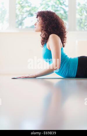 Hispanic woman practicing yoga Stock Photo