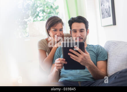 Couple using digital tablet together Stock Photo