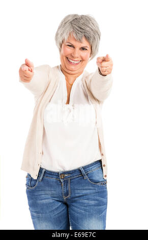 Happy Elderly woman looking and pointing to the camera Stock Photo