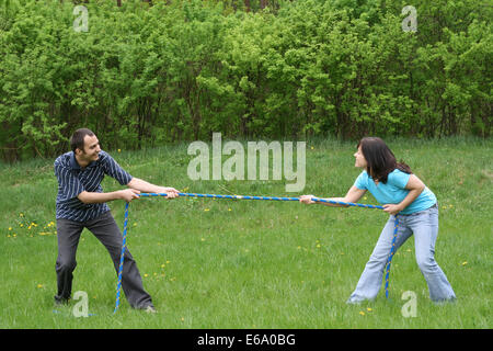 love couple,power struggle,tug-of-war Stock Photo