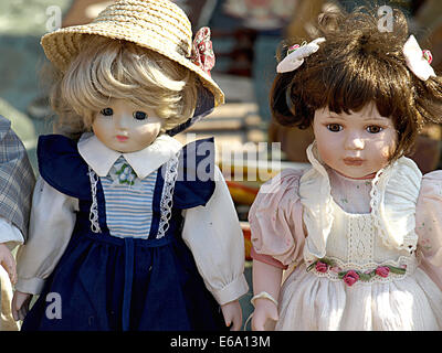 Old dolls for sale at antiques fair Stock Photo