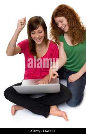 Two girlfriends chatting on laptop via video call application. Girl on ...