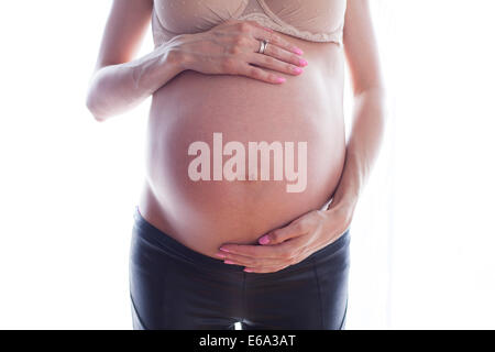 Photo of an attractive  woman who is 32 weeks pregnant Stock Photo