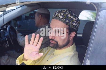 Srinagar, Indian Administered Kashmir. 19th Aug, 2014. Chairman of All Parties Hurriyat Conference (APHC),  Kashmiri separatists, Mirwaiz Umar Farooq, waves after leaving to New Delhi for a meeting with Pakistani high commissioner in Srinagar In a blow to efforts to improve often-hostile ties, India on Monday called off talks with Pakistan over a meeting between its ambassador and Kashmiri separatists. Credit:  Sofi Suhail/Alamy Live News Stock Photo