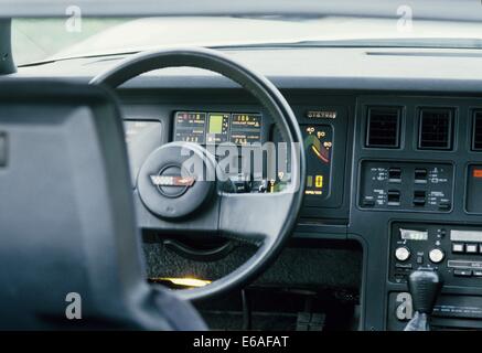 Chevrolet Corvette Stingray C4 4th generation - 1984 Model Year MY in silver grey - showing close up detail of steering wheel and drivers instrument panel and speedometer tachometer and other controls Stock Photo