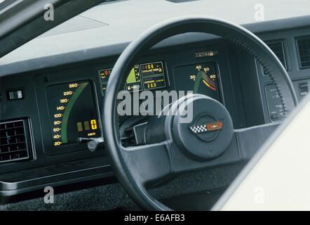 Chevrolet Corvette Stingray C4 4th generation - 1984 Model Year MY in silver grey - showing close up detail of steering wheel and drivers instrument panel and speedometer tachometer and other controls Stock Photo