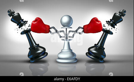 New competition business concept with a chess pawn punching and destroying competitors as two king pieces with hidden red boxing gloves as a metaphor for innovative corporate attack strategy and planning to win. Stock Photo