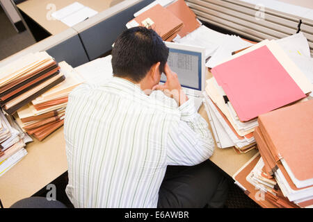 revised,overtime,stress,struggle,businessman Stock Photo