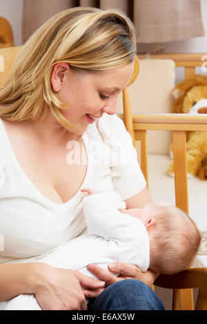 Breastfeeding a 3 year old girl Stock Photo - Alamy