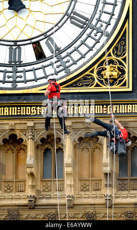 London, UK. 19th Aug, 2014. Cleaning the clockfaces of Big Ben. For the first time since 2010, the glass panels in the four faces of the clock of the Elizabeth Tower (known as Big Ben, which is actually the bell inside) are being cleaned. It is expected to take four days - one day for each face Stock Photo