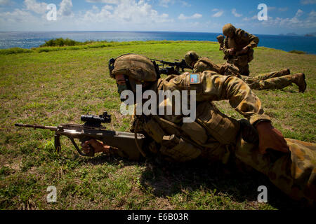 Australian soldiers with Delta Company, 5th Battalion, Royal Australian Regiment conduct a tactical live-fire demonstration during the Rim of the Pacific (RIMPAC) 2014 exercise July 29, 2014, at a range at Marine Corps Base Hawaii in Kaneohe, Hawaii. RIMP Stock Photo