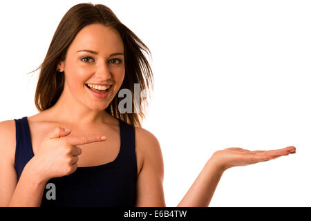 Happy asian caucasian woman holds hand in copyspace isolated over white Stock Photo