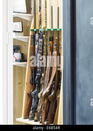 Rifles and Shotguns in Home Gun Safe,  Residential Home, MT, USA Stock Photo