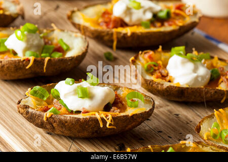 Homemade Potato Skins with Bacon Cheese and Sour Cream Stock Photo