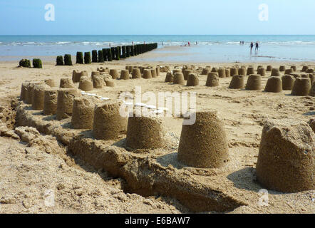 Sand castles on Bridlington beach on lazy sunny day Stock Photo