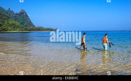 Snorkelers at Tunnels Beach on Kauai, with Mt. Makana, called Bali Hai, in background Stock Photo