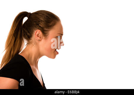 Angry young woman screams into a copy space isolated Stock Photo